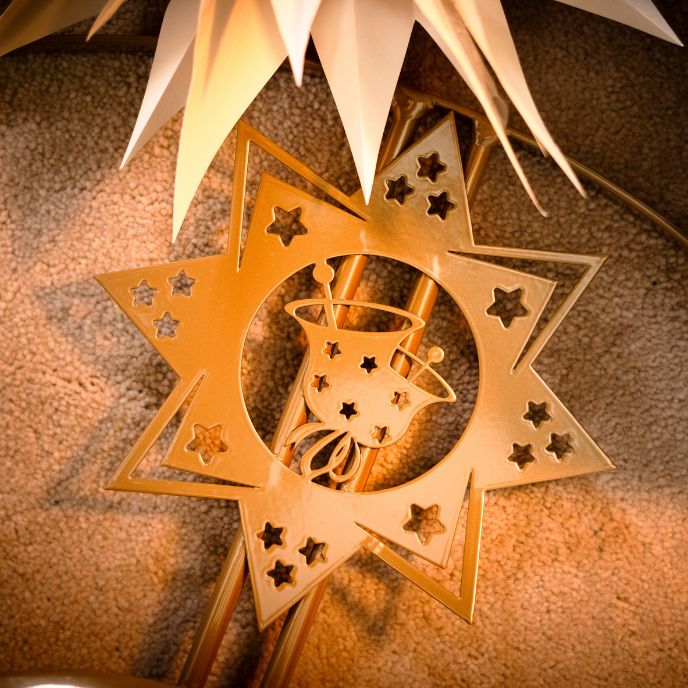 Gold decorative star Christmas tree stand made from durable steel.