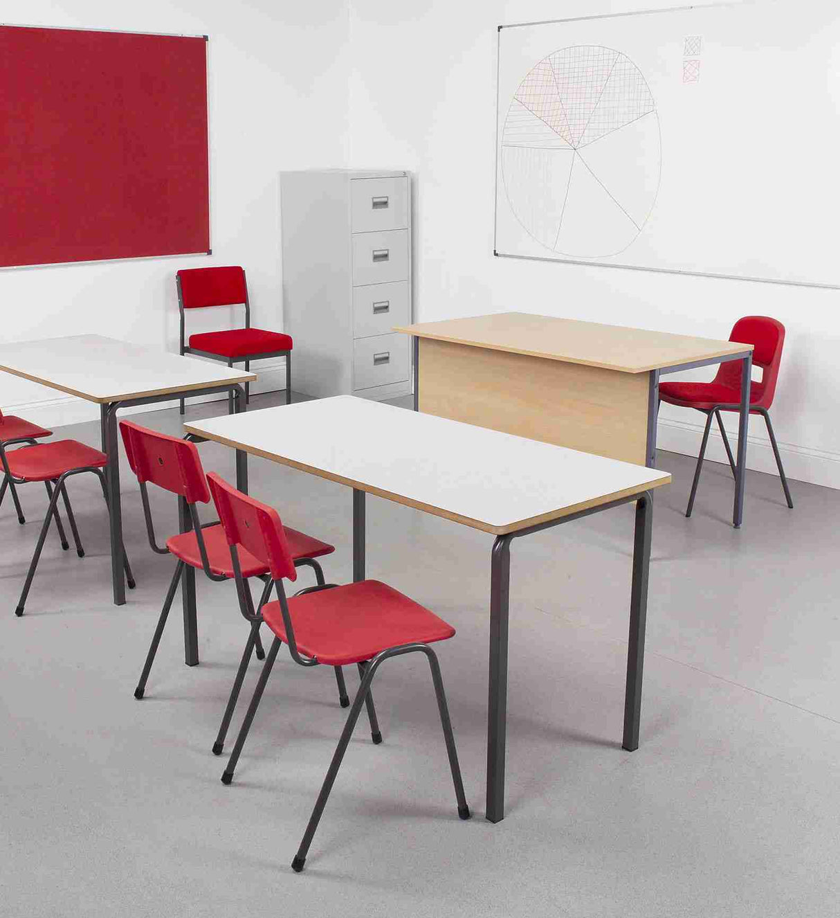 MX24 Polypropylene Chair in classroom setting with red seating and tables.