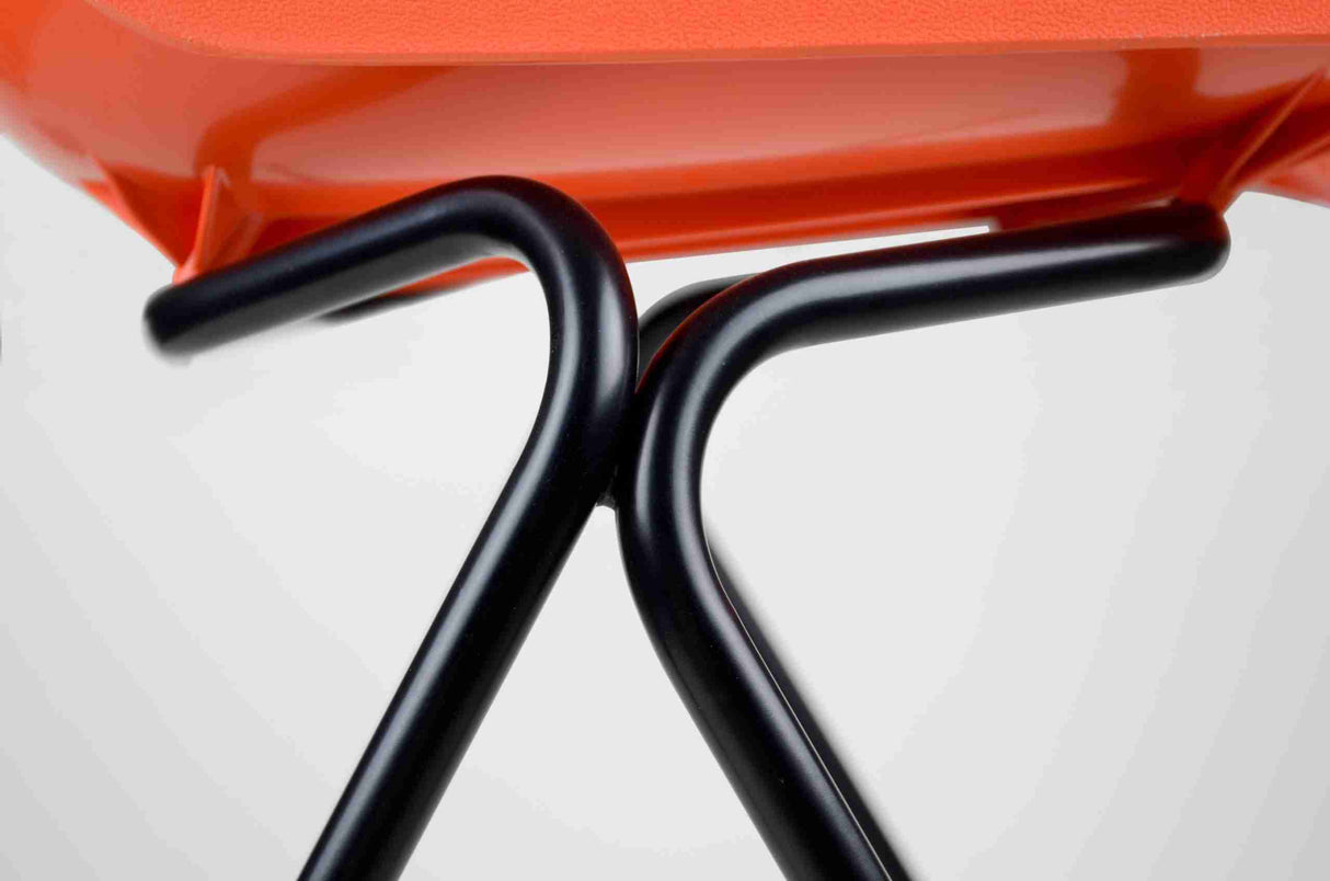 Hille Classics Polyside Chair with elegant black metal frame and vibrant orange seat.