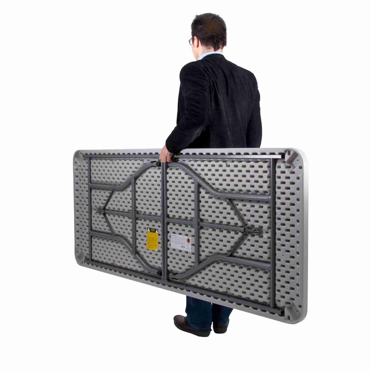 Man carrying foldable Newstorm 6ft solid rectangle polypropylene table with folding legs, ideal for versatile events.