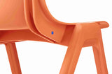 Close-up of orange Ergostak Chair showcasing ergonomic design and sleek aesthetics.
