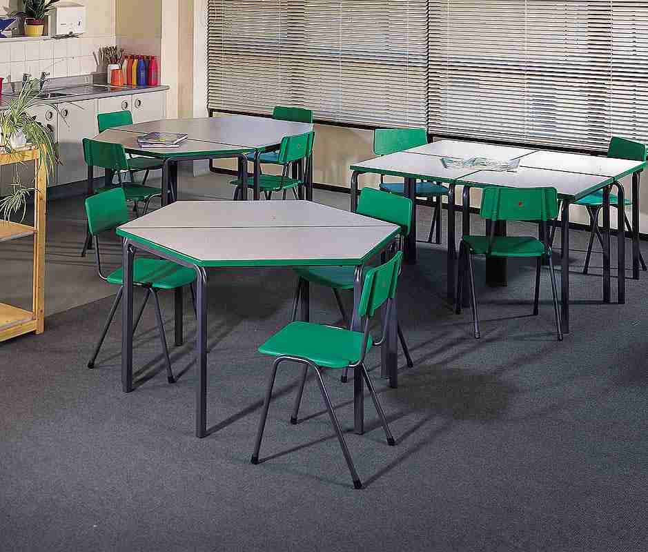 Green MX24 Polypropylene Chairs in a classroom setting.