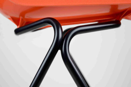 Hille Classics Polyside Chair with elegant black metal frame and vibrant orange seat.